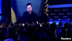 Ukrainian President Volodymyr Zelenskyy addresses the Warsaw Security Forum by video link on October 12.