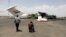 Media photographers take pictures of a destroyed plane at Sanaa International Airport in the aftermath of an Israeli airstrike earlier this month. 
