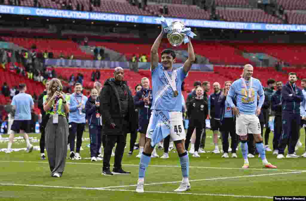 Manchester City's 22-year-old defender Abdukodir Khusanov, pictured celebrating his team's FA cup win in May 2026, is the highest profile of some 20 Uzbeks currently contracted to foreign clubs. Several of those young professionals, including Khusanov, will play in Uzbekistan's 2026 World Cup campaign.