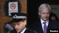 WikiLeaks founder Julian Assange emerges from the High Court in London after a December court appearance to fight his extradition to face sexual-assault charges in Sweden.