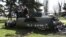 UKRAINE – Ukrainian servicemen stand next to a fragment of a Tochka-U missile with a writing in Russian "For children" , on a grass after Russian shelling at the railway station in Kramatorsk, April 8, 2022