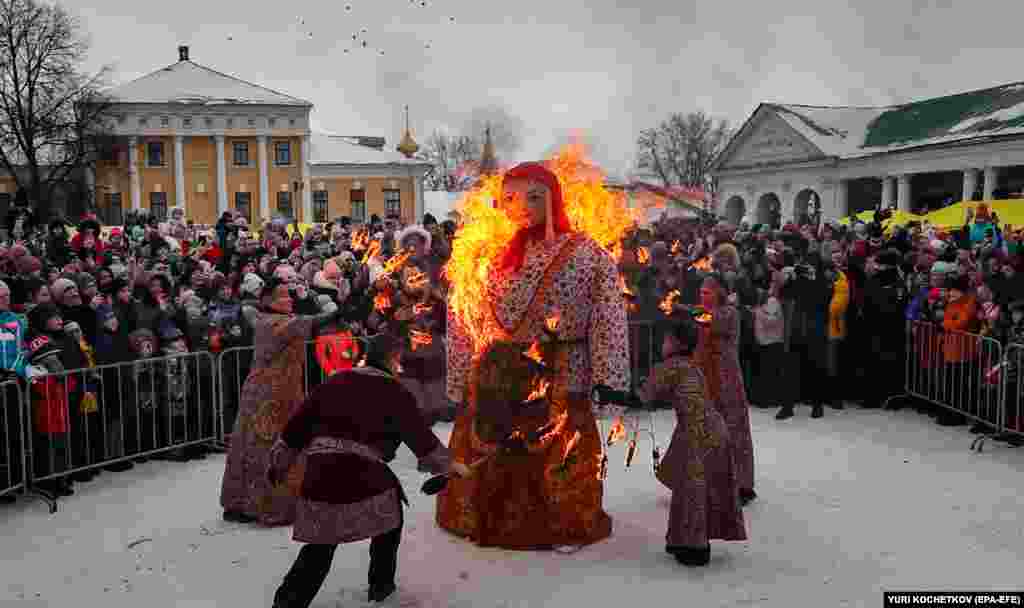 Russians watch a burning effigy of Lady Maslenitsa in Suzdal.