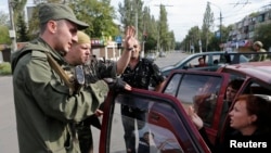 With so many armed men patrolling the streets, it's easy to end up in a separatist jail in Donetsk. (file photo)