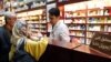 Iranians shop at a drugstore at the Nikan hospital in Tehran on September 11, 2018. - Judges at the International Court of Justice in The Hague unanimously ruled Washington should remove barriers to "the free exportation to Iran of medicines and medical d