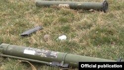 Nagorno-Karabakh - Rocket-propelled grenade launchers and a rifle magazine allegedly left behind by Azerbaijani forces in a gun battle with Karabakh Armenian forces, 19Mar2015.