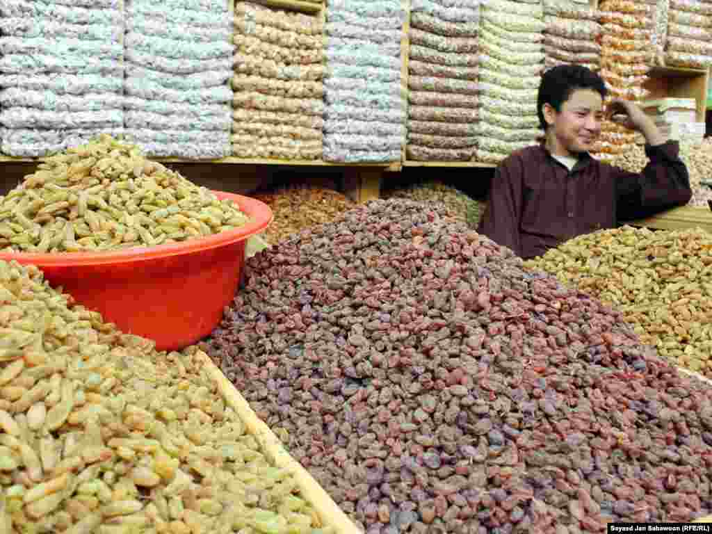 An Afghan shopkeeper prepares his wares at a market in Kabul on September 9. Sayed Jan Sabawoon of RFE/RL's Radio Free Afghanistan visited a Kabul market ahead of the festival of Eid al-Fitr, which is celebrated in Afghanistan on September 10.