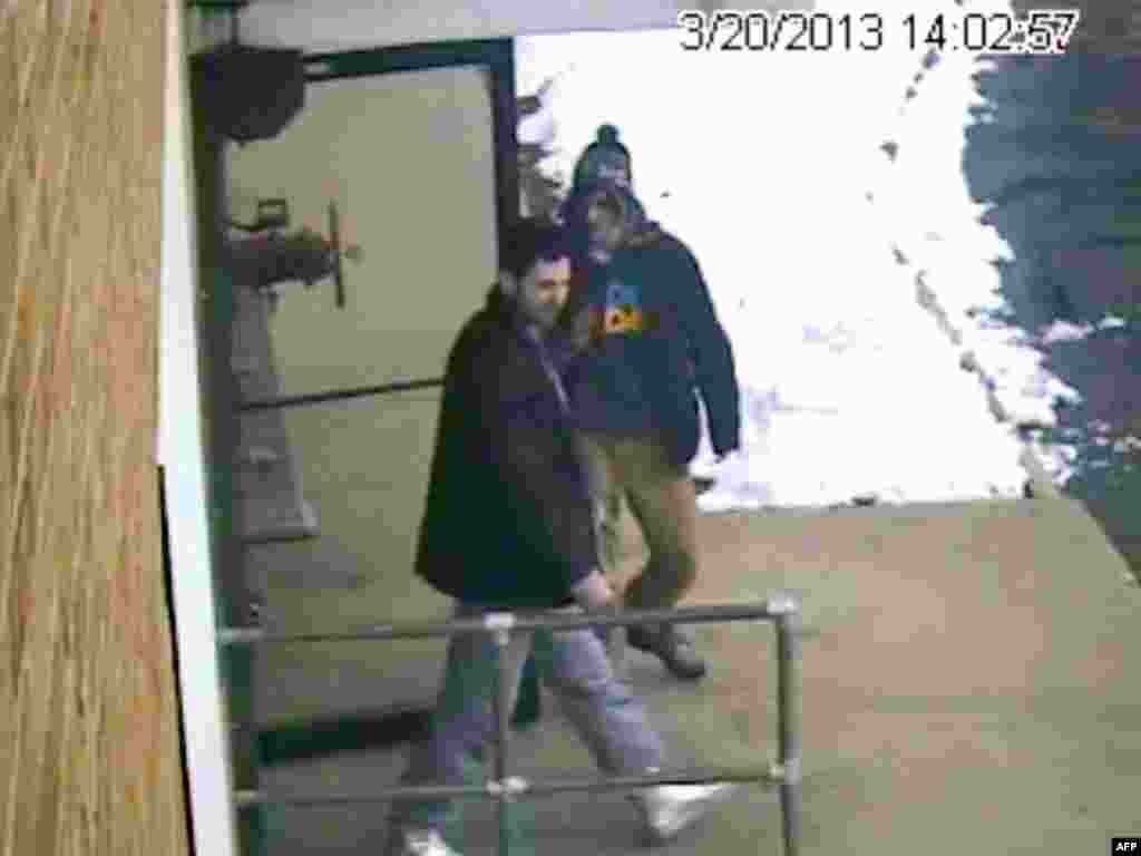 A video grab shows Dzhokhar Tsarnaev (right) and his brother Tamerlan leaving a New Hampshire firing range in March 2013, less than a month before the Boston Marathon bombings.