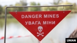 A sign warning of the danger of landmines in eastern Ukraine (file photo).