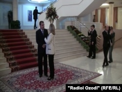 Clinton is welcomed by Tajik President Emomali Rahmon on October 22.