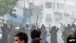 Riot police block protesters on the streets of Tehran on June 20.