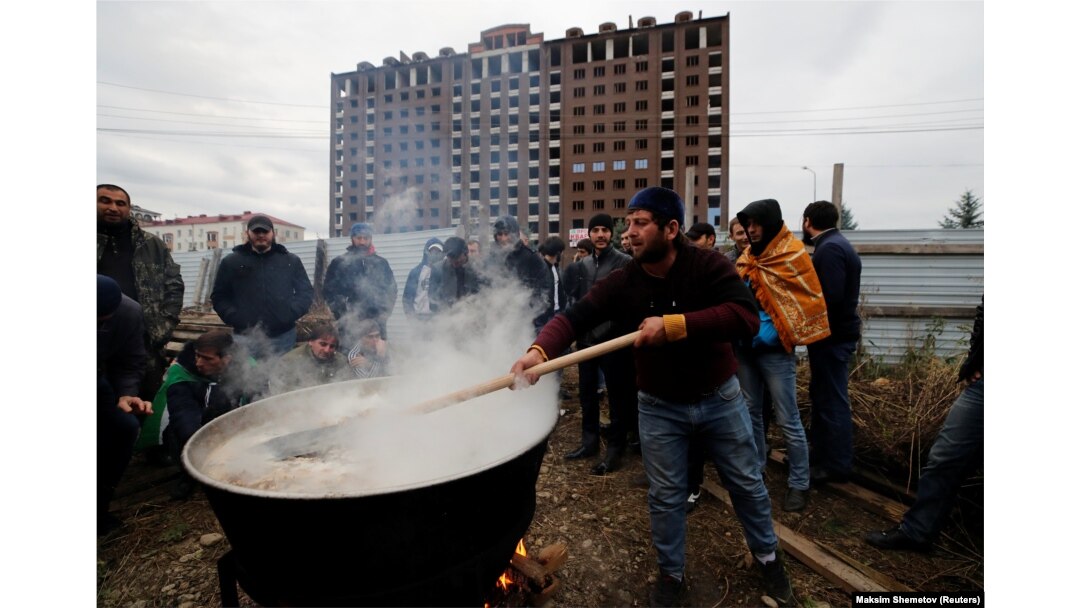 A man in Magas prepares a meal for protesters.