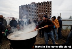 A man in Magas prepares a meal for protesters.