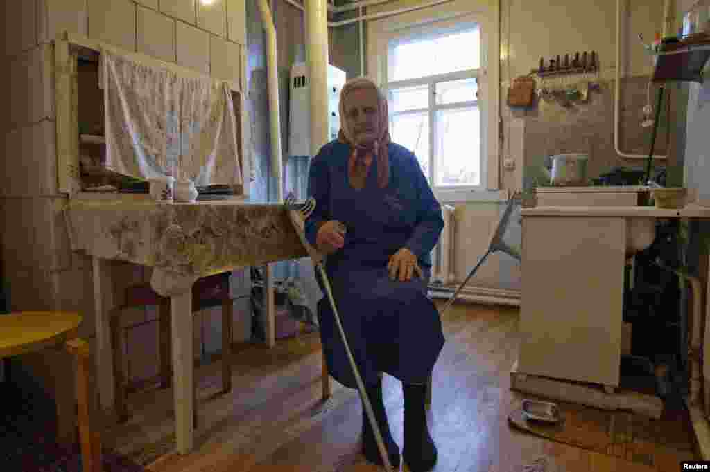 Nadzeya Demidovich, 86, poses for a photo at her house in Kalodzishchy, on the outskirts of Minsk on October 26, 2013. Demidovich says she was sentenced to 25 years in concentration camps in Kazakhstan and Russia for her membership in the banned Union of Belarusian Youth.