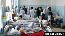AFGHANISTAN -- Wounded people receive treatment in a hospital after a powerful bomb blast in Kabul, Afghanistan, Monday, July 1, 2019.
