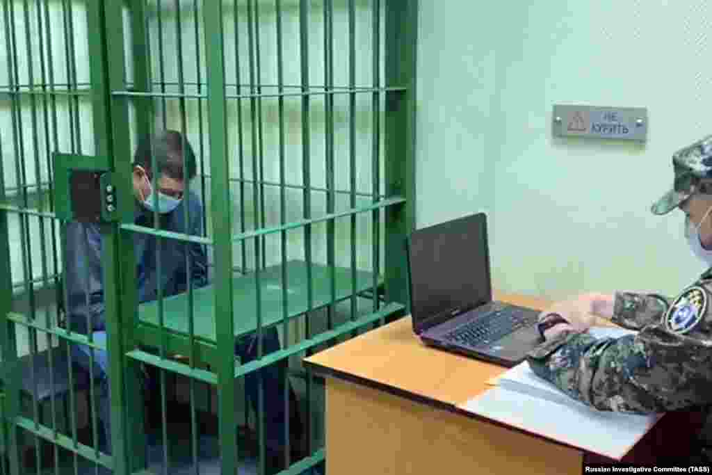 An investigator interrogates Vyacheslav Starostin, who was in charge of the power plant where the incident occurred. On June 4, a regional court ordered that Starostin be placed in pretrial detention until July 31. He was charged with negligence and violating environmental regulations.