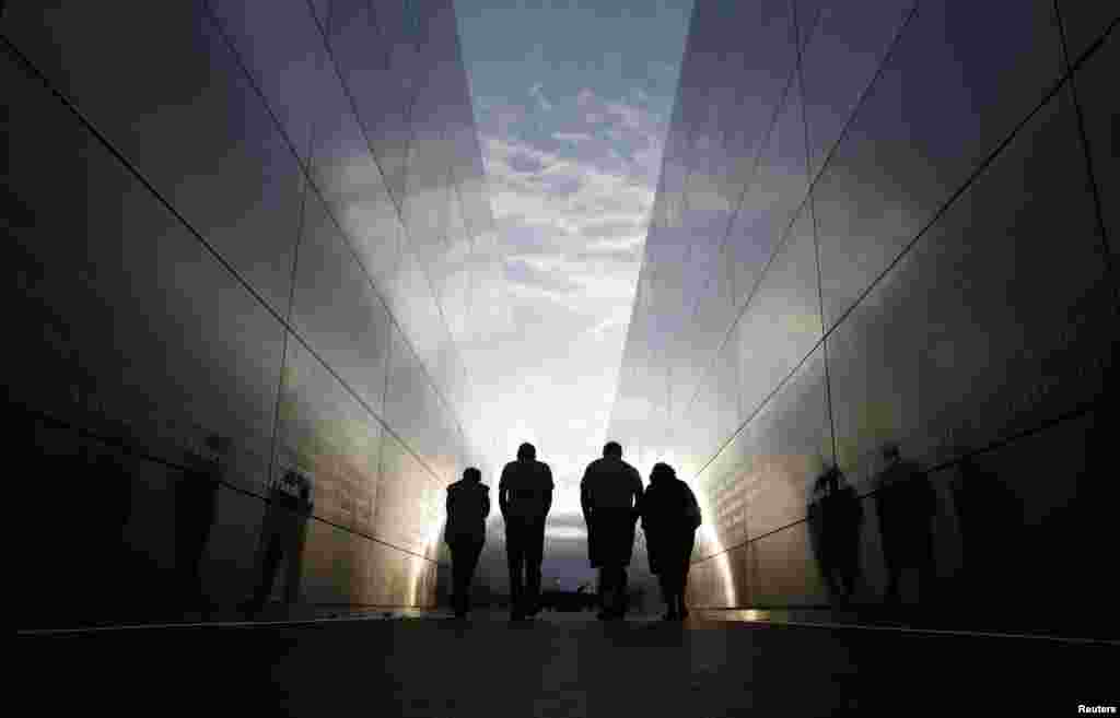 People walk through the 9-11 Empty Sky memorial across from New York&#39;s One World Trade Center at Liberty State Park in Jersey City, New Jersey. (Reuters/Gary Hershorn)