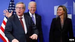 European Commission President Jean-Claude Juncker (left) and EU foreign-policy chief Federica Mogherini (right) meet with U.S. Vice President Joe Biden in Brussels last month.