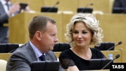 Denis Voronenkov (left) and his wife, Maria Maksakova, who is also a former Russian lawmaker, left Russia for Ukraine in October 2016. (file photo)