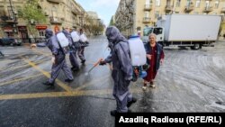 Cleaners disinfect the streets of Baku amid a coronavirus lockdown. (file photo)