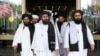 FILE: Members of a Taliban delegation, led by chief negotiator Mullah Abdul Ghani Baradar (center, front), leave after peace talks with Afghan senior politicians in Moscow in May 2019. 