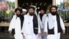 Members of a Taliban delegation, led by chief negotiator Mullah Abdul Ghani Baradar (center), leave after peace talks with Afghan politicians in Moscow in May.