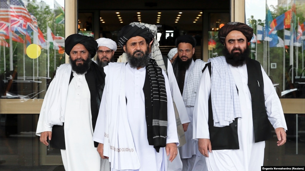 Members of a Taliban delegation, led by chief negotiator Mullah Abdul Ghani Baradar (center), leave after peace talks with Afghan politicians in Moscow in May.