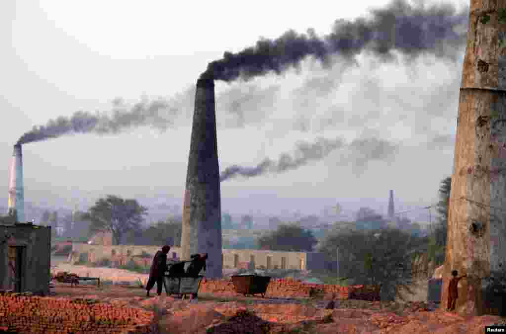 Smoke rises from brick factories on the outskirts of Islamabad on June 8. (Reuters/Faisal Mahmood)