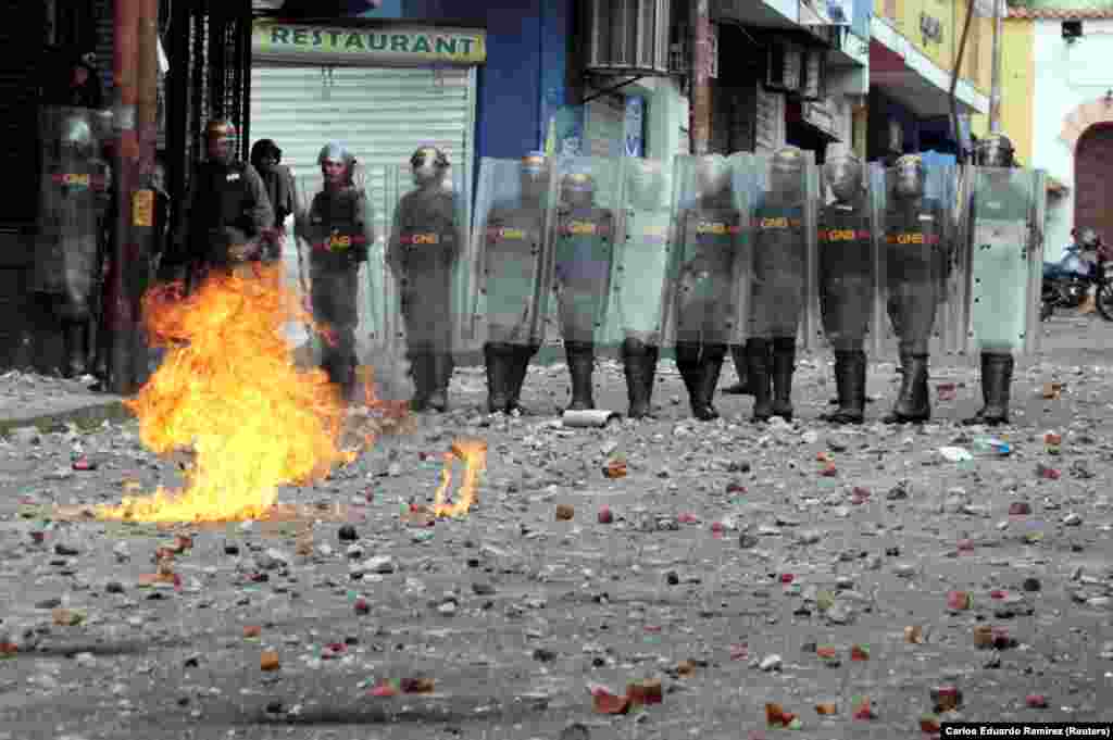 Security forces hold their position during protests in Tachira, western Venezuela. &nbsp;