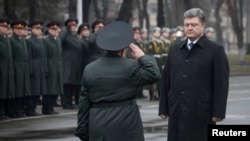Ukrainian President Petro Poroshenko (right) visits the National Defense University in Kyiv on February 27.