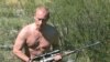 A shirtless Putin famously hunts in the foothills of the Sayan Mountains in the Republic of Tuva in August 2007.
