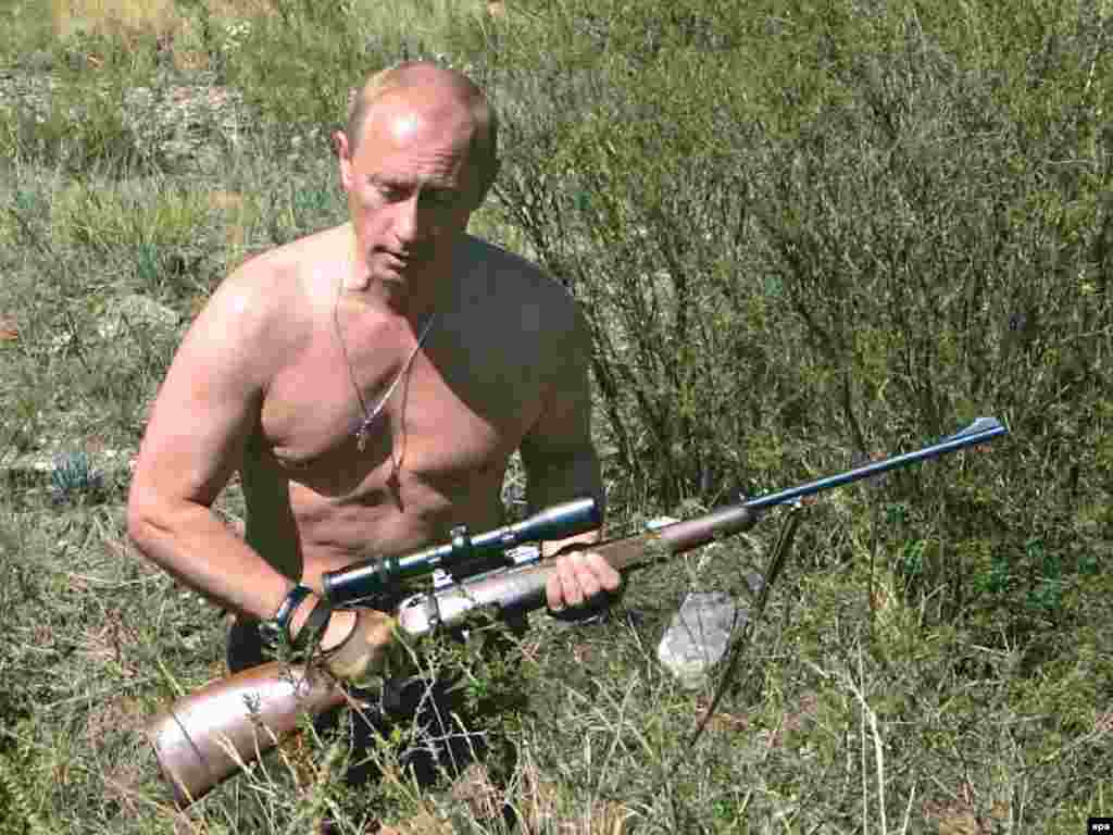 A shirtless Putin famously hunts in the foothills of the Sayan Mountains in the Republic of Tuva in August 2007.