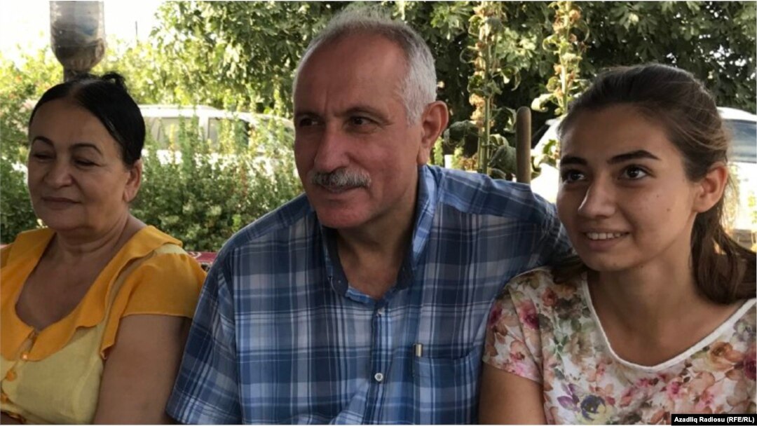 A happy Mehman Aliyev, with his wife Zemfira Aliyeva (left) and their daughter, Leyla, after his release from prison on September 11.