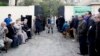 Քվեարկելու եկած եգիպտացիները ընտրատեղամասի մոտ իրենց հերթին են սպասում, Կահիրե, 14-ը հունվարի, 2014թ.