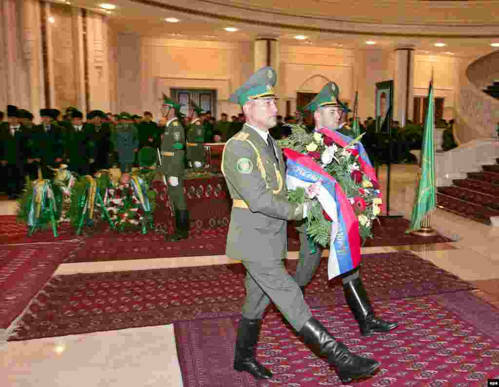 An honor guard presents a wreath from the Russian government at the service for Niyazov in Ashgabat (epa) - "There were 20 delegations at the level of heads of state and government, mostly from regional countries: Iran, Uzbekistan, Kazakhstan, Afghanistan," Drabok said. "Russia was represented by Prime Minister Mikhail Fradkov. Western countries were represented by ambassadors. No officials spoke at the farewell ceremony."