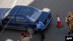 Police and soldiers secure the site of the apparent suicide bombing in Sana'a on April 26.