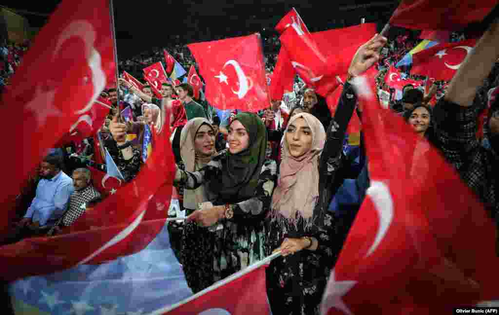 Supporters cheer as Turkish President Recep Tayyip Erdogan speaks during a preelection rally in Sarajevo on May 20. (AFP/Oliver Bunic)