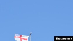 Shutterstock - England flag over castle