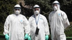 Armenia -- Medical personnel clad in protective gear pose for a photograph outside the Surp Grigor Lusavorich hospital in Yerevan, April 9, 2020.