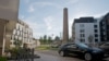 A car with Russian plates in the courtyard of an apartment complex in Riga. Critics fear much of the money from the visa scheme ends up in Russia or other countries.