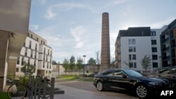 A car with Russian plates in the courtyard of an apartment complex in Riga. Critics fear much of the money from the visa scheme ends up in Russia or other countries.