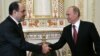 Russian President Vladimir Putin meets with Iraqi Prime Minister Nuri al-Maliki on October 10.