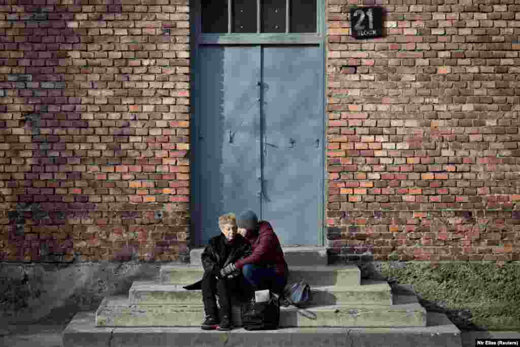 Jona Laks and her granddaughter, Lee Aldar embrace during their visit to the Auschwitz death camp in Oswiecim, Poland January 26, 2020. Sitting with her granddaughter outside the shuttered barrack, Laks was overcome by a sense of triumph. &ldquo;I&rsquo;m here with my granddaughter and I overcame. I won the war. We have a future,&rdquo; she said.