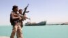 Yemen -- Pro-government forces walk in the port of the western Yemeni coastal town of Mokha as they advance in a bid to try to drive the Shiite Huthi rebels away from the Red Sea coast on February 9, 2017. Forces supporting President Abedrabbo Masnou