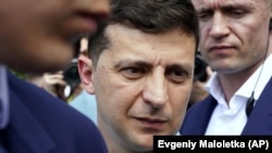 UKRAINE – Ukrainian President Volodymyr Zelenskiy arrives at a polling station during a parliamentary election in Kyiv, July 21, 2019