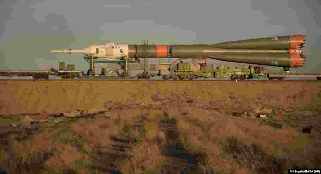 The Soyuz rocket is rolled out by train to the launch pad on October 9.