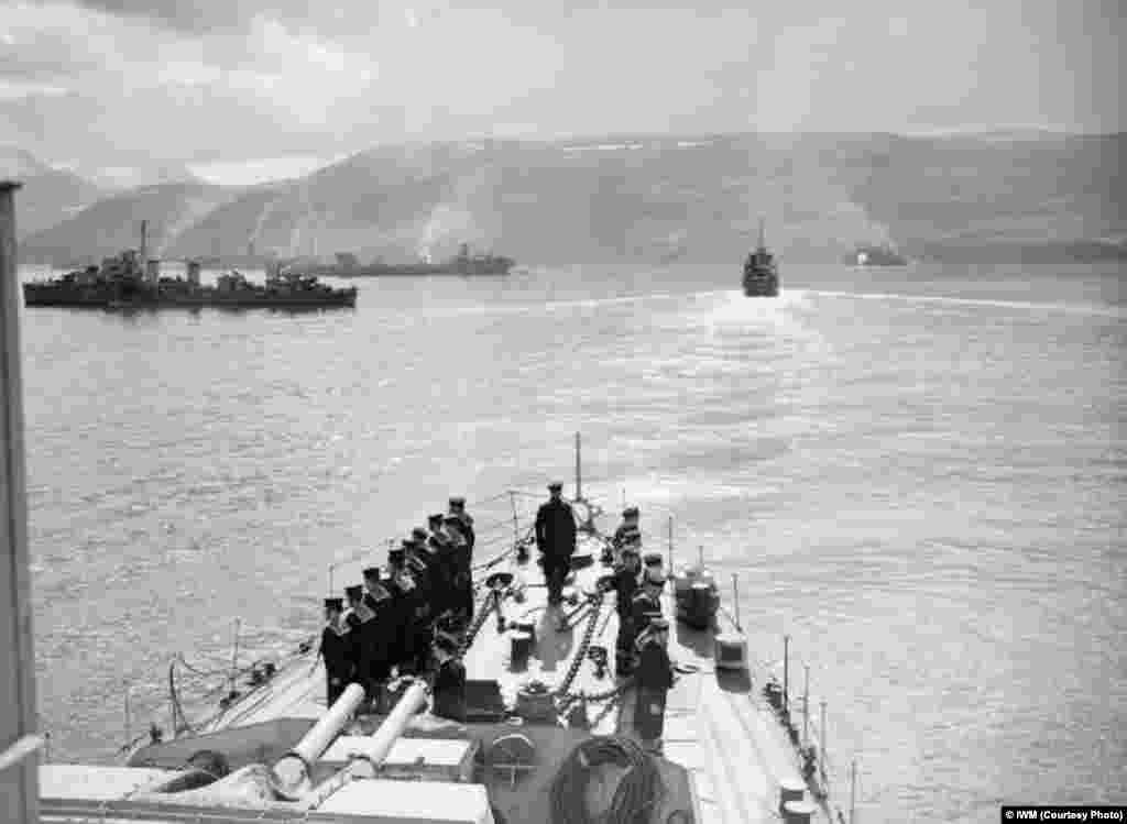 Escorts and merchant ships at the Icelandic port of Hvalfjord before setting sail for Russia in July 1942.