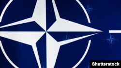 NATO logo.