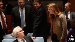 US Ambassador to the UN Samantha Power argues with Churkin prior to a vote on a resolution on Ukraine during a UN Security Council emergency meeting at United Nations headquarters in New York on March 15, 2014.