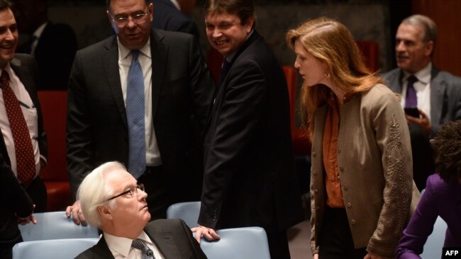 US Ambassador to the UN Samantha Power argues with Churkin prior to a vote on a resolution on Ukraine during a UN Security Council emergency meeting at United Nations headquarters in New York on March 15, 2014.