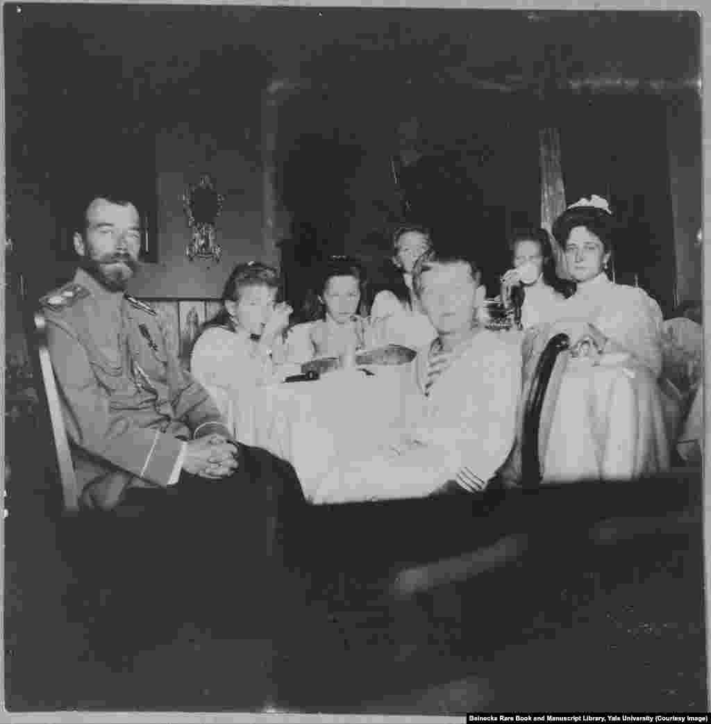 Nicholas II and his wife, Empress Aleksandra (far right), with their four daughters and son. The tsar was forced to abdicate in 1917 and he and his family were shot and stabbed to death by Bolshevik troops, in 1918, before their bodies were doused in acid and dumped into a mine shaft.